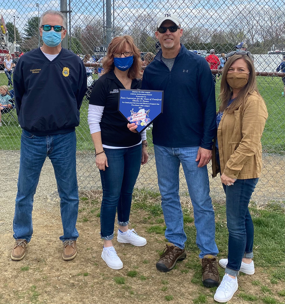 At Saturday’s Pine Bush Little League opening day ceremony, Crawford Town Supervisor Charles Carnes received the District 19 Little League Lifetime Achievement Award. He received this award for his dedicated service and efforts to support Pine Bush Little League. The Crawford Town Board accepted the award on Carnes’ behalf. From left to right: Councilman Rory Holmes, Councilwoman Kelly Eskew, Councilman Mike Menendez and Town Clerk Jessica Kempter.
